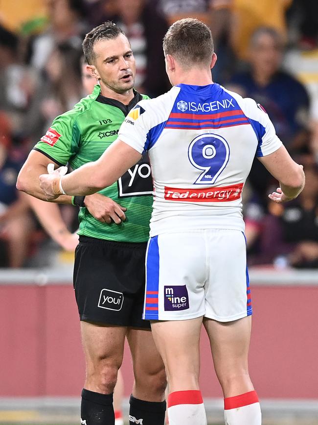 Jayden Brailey of the Knights talks to referee Grant Atkins during the Newcastle and Wests Tigers clash. Picture: Bradley Kanaris/Getty Images