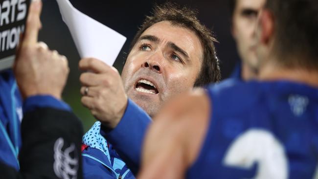 Kangaroos coach Brad Scott has been at the helm for 10 years.