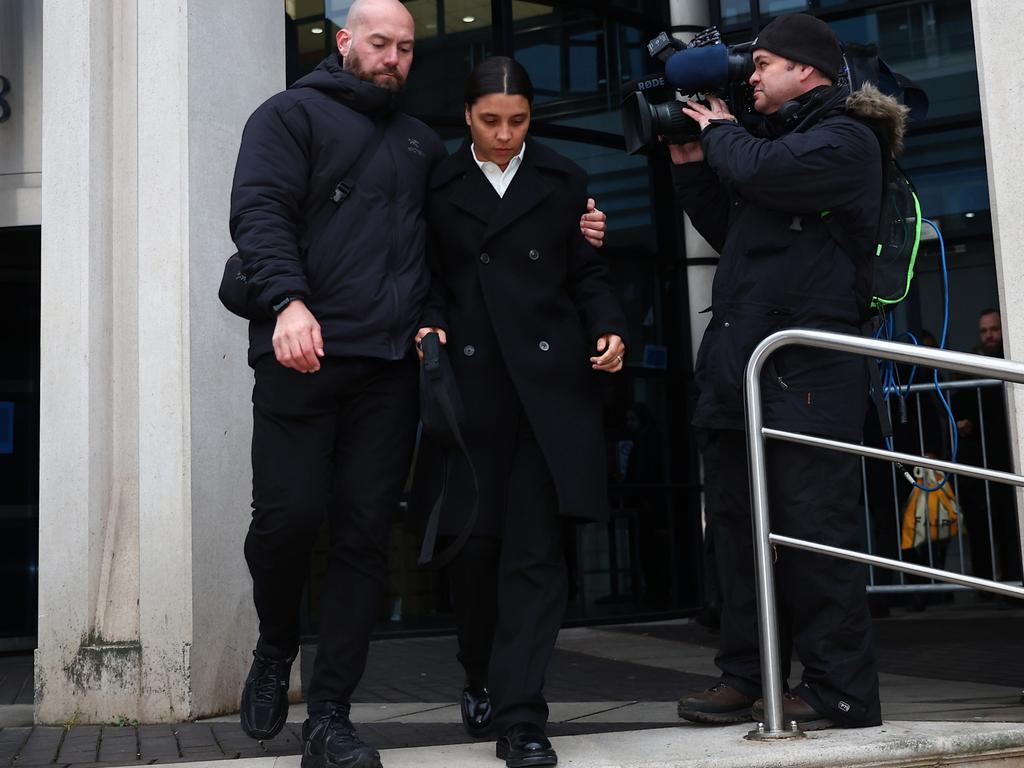 The football star is flanked by a man believed to be her bodyguard. Picture: Getty Images