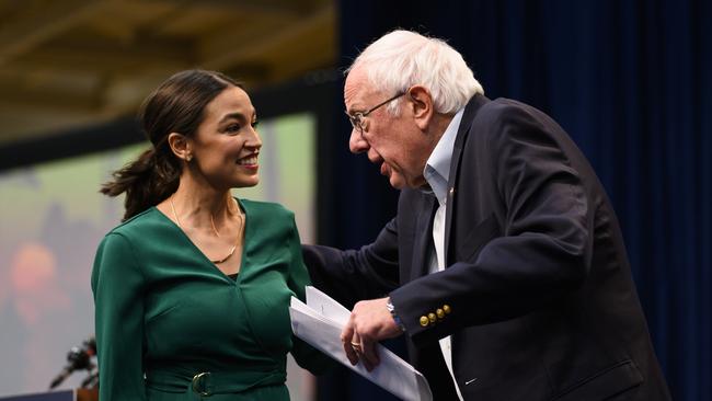 Alexandria Ocasio-Cortez is joined on stage by Democratic Presidential candidate Bernie Sanders. Picture: AFP