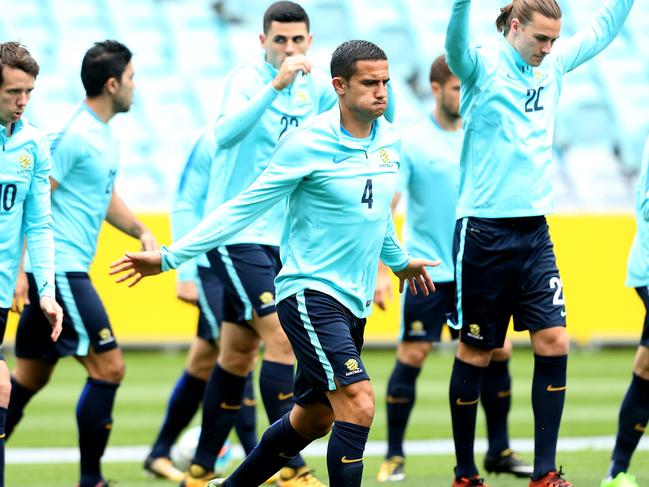 Tim Cahill warms up as  Socceroos train at ANZ Stadium in the  Sydney Olympic Park precinct ahead of Tuesday nights second leg of the World Cup play off against Syria.