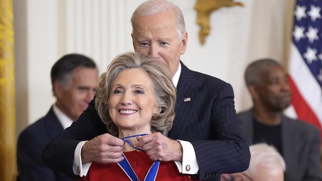 President Joe Biden, right, presents the Presidential Medal of Freedom, the Nation's highest civilian honor, to former Secretary of State Hillary Clinton, in the East Room of the White House, Saturday, Jan. 4, 2025, in Washington. (AP Photo/Manuel Balce Ceneta)