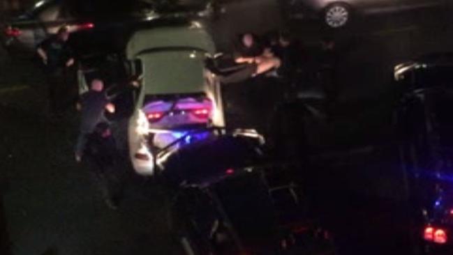 The alleged offender is seized by police immediately after the shooting. Picture: 7 News