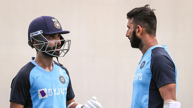 India’s Cheteshwar Pujara (right) talks to the team captain Ajinkya Rahane during a training session at the Sydney Cricket Ground. Picture: AFP