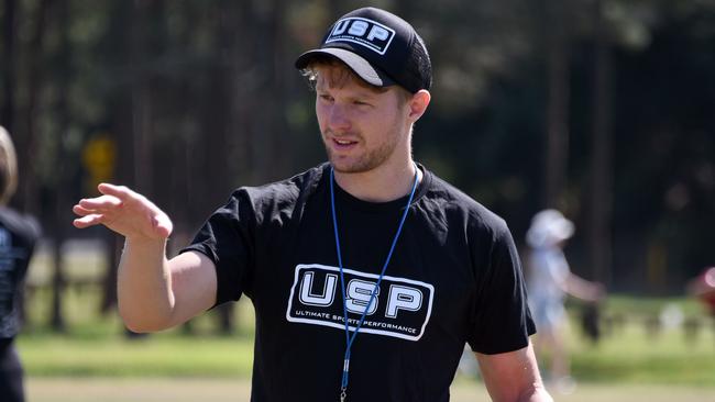 Former Gold Coast Sun Mackenzie Willis, pictured coaching at an AFL off-season training camp, is yet to arrive in Tasmania to join the Tigers. (Photo/Steve Holland)