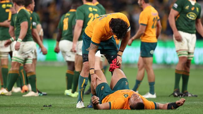 Allan Alaalatoa is consoled by Darcy Swain after the Wallabies’ loss. Picture: Mark Metcalfe/Getty Images