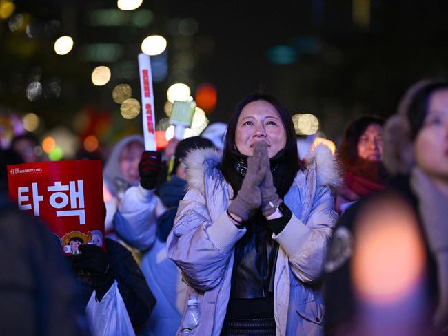 Around 150,000 South Koreans protested outside parliament calling for the ousting of the president on Saturday. Picture: AFP