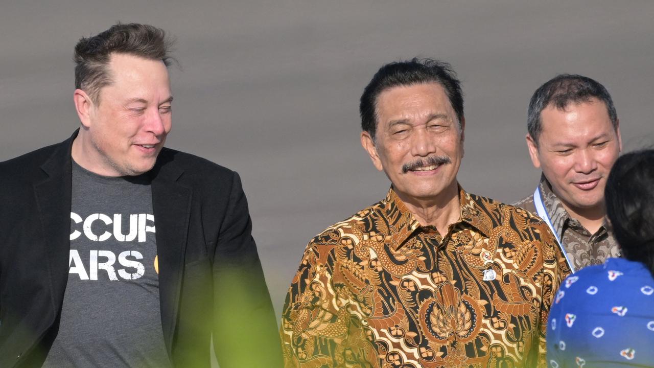 Tech billionaire Elon Musk walks with Indonesia's Coordinating Minister of Maritime and Investment Affairs, Luhut Binsar Pandjaitan during his arrival into Bali over the weekend. Picture: Sonny Tumbelaka / AFP