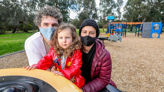 Gus Gollings and Fleur Bowman, pictured with daughter Goldie, are upset playgrounds have closed. Picture: Tim Carrafa