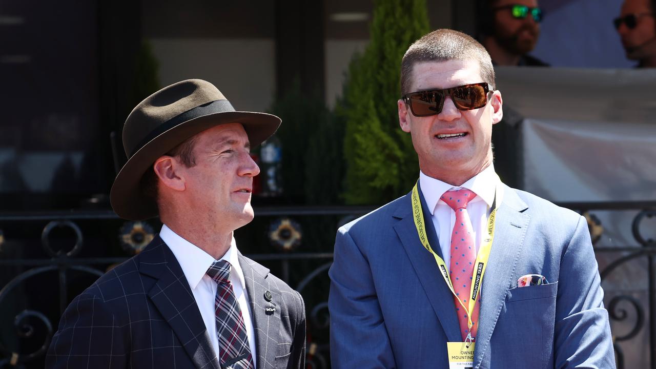 MELBOURNE , AUSTRALIA. November 7, 2023. Melbourne Cup races at Flemington Racecourse, Melbourne. Race 3. The TAB Trophy. Ex Brisbane champion Jonathan Brown talks with trainer Ciaron Maher before his horse Big Swan ran in race 3 . Pic: Michael Klein