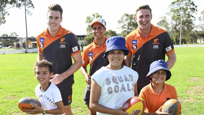 Jeremy Cameron, Nick Shipley and Dawson Simpson at a community clinic.