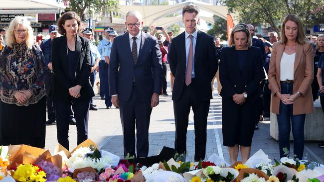 Allegra Spender, Prime Minister Anthony Albanese and NSW Premier Chris Minns lay floral tributes at Westfield Bondi Junction on April 14. Picture: Lisa Maree Williams/Getty Images