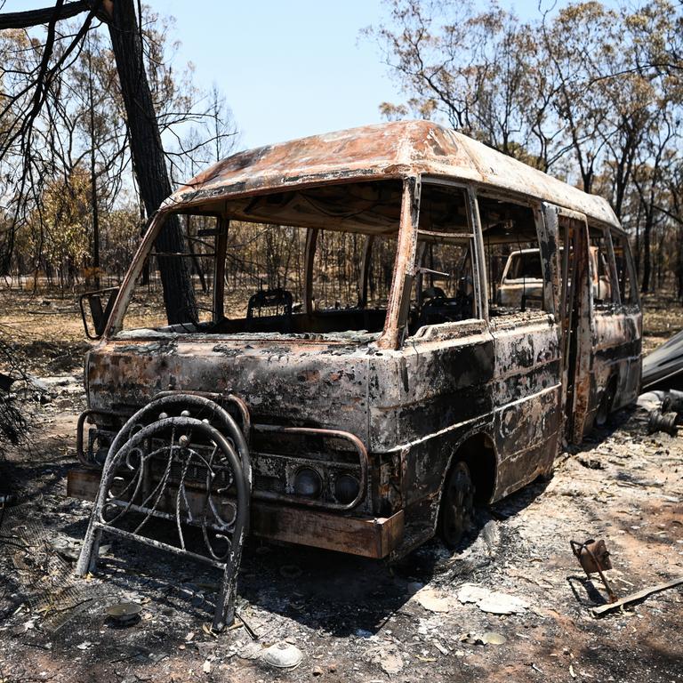 A burnt-out bus at a property destroyed by a bushfire near Tara, Queensland, about 300 kilometres west of Brisbane. Fire fighters have been battling multiple bushfire in Queensland and NSW. Picture: NCA NewsWire / Dan Peled