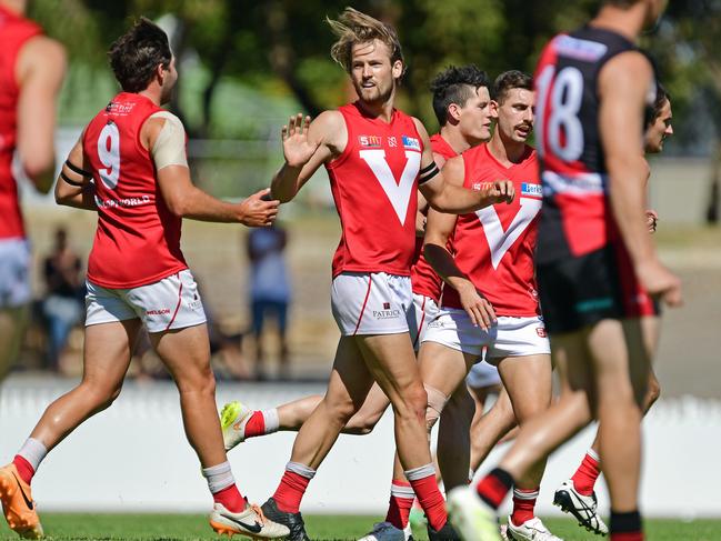 08/04/18 - SANFL: North Adelaide v West Adelaide at Prospect Oval.  North's Lewis Hender celebrates kicking a goal with team mates.Picture: Tom Huntley