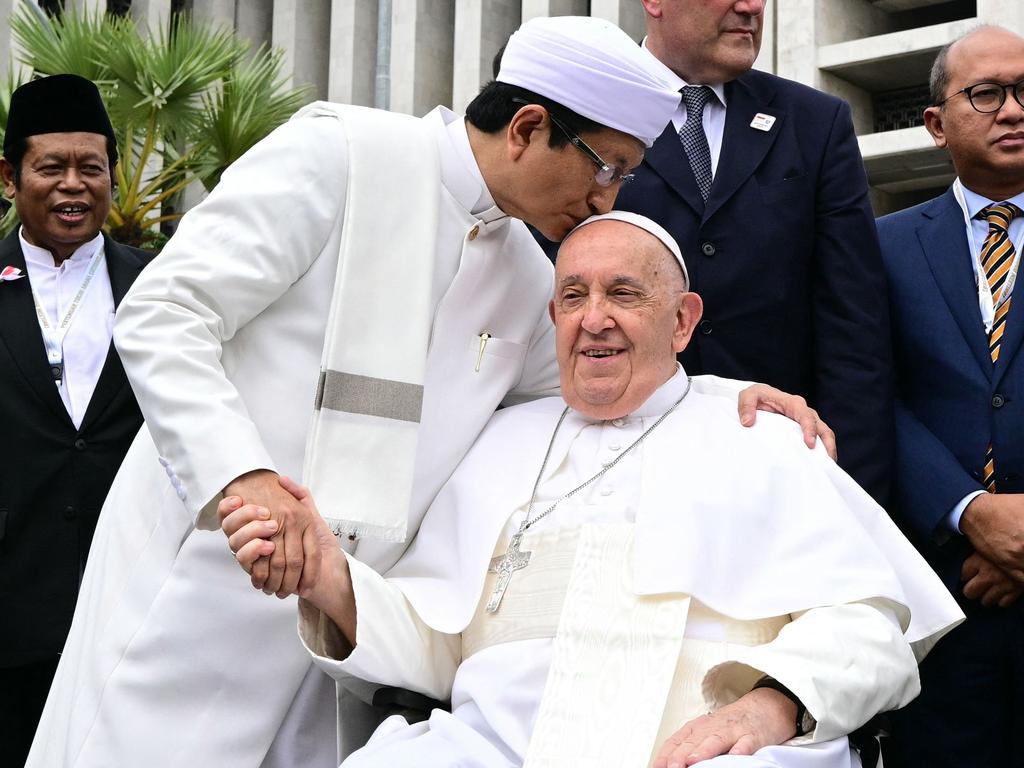 Grand Imam of Istiqlal Mosque Nasaruddin Umar (L) shakes hands with Pope Francis after an interreligious meeting with religious leaders at the Istiqlal Mosque in Jakarta on September 5, 2024. Picture: AFP