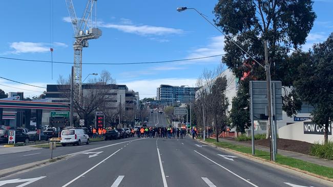 Tradies block a Hawthorn street on Tuesday after two men were assaulted at construction site. Picture: Aneeka Simonis