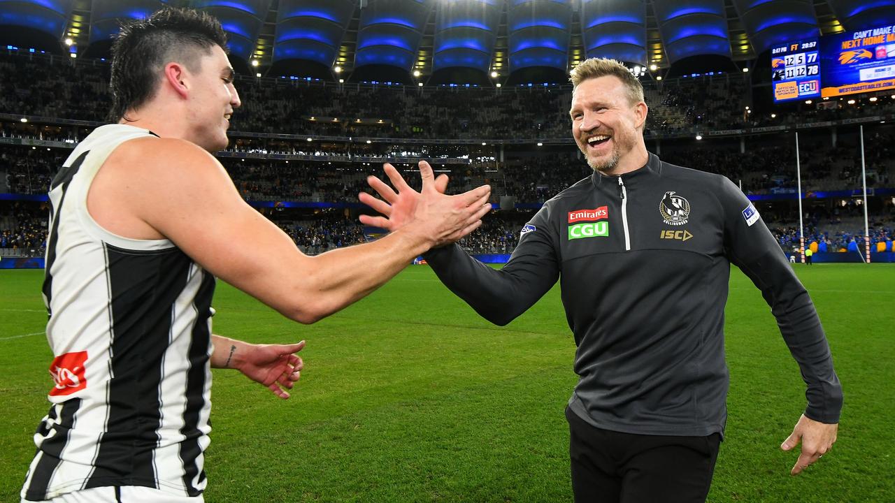 Collingwood coach Nathan Buckley celebrates the win with Brayden Maynard. Picture: AFL Photos/Getty Images