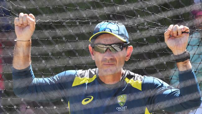 Coach Justin Langer looks on to players during the Australian team training session at the Adelaide Oval in Adelaide, Wednesday, December 5, 2018. Australia play India in the first Test match Thursday. (AAP Image/Dave Hunt) NO ARCHIVING