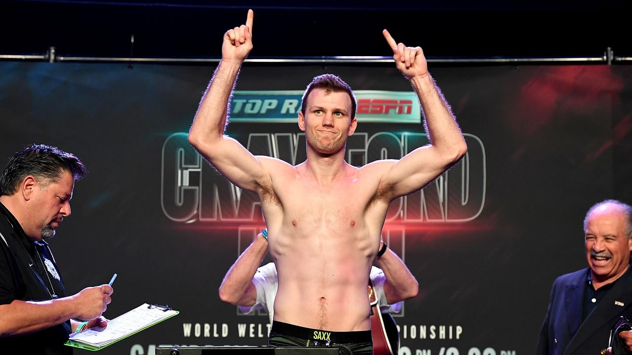 Australian boxer Jeff Horn and wife Joanne arrive to check in for their  flight at Brisbane airport, Wednesday, May 30, 2018. Horn will battle  American boxer Terence Crawford in a world welterweight