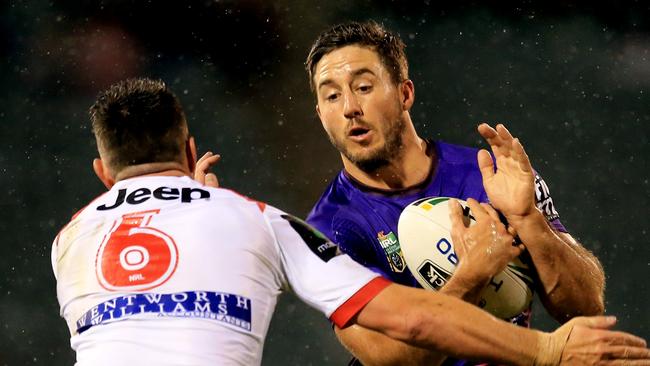 Ben Hunt of the Broncos tackled by Gareth Widdop of the Dragons during the St George Illawarra Dragons v Brisbane Broncos round 22 NRL game at WIN Stadium, Wollongong. pic Mark Evans