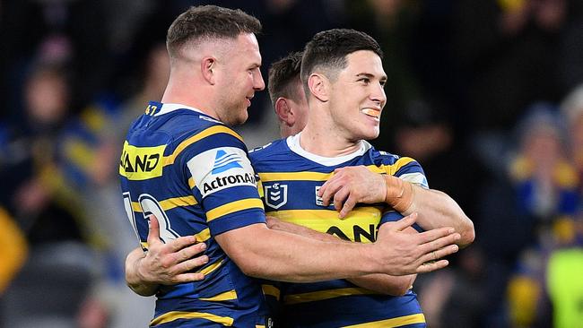 Mitchell Moses celebrates with Nathan Brown following the win. Picture: AAP Image/Dan Himbrechts