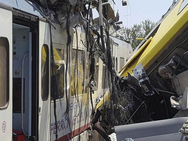 Crumpled wagon cars are seen after two commuter trains collided head-on near the town of Andria, in the southern region of Puglia. Picture: Italian Firefighter Press Office via AP