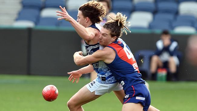 Lowson lays a tackle during a VFL match for Coburg.