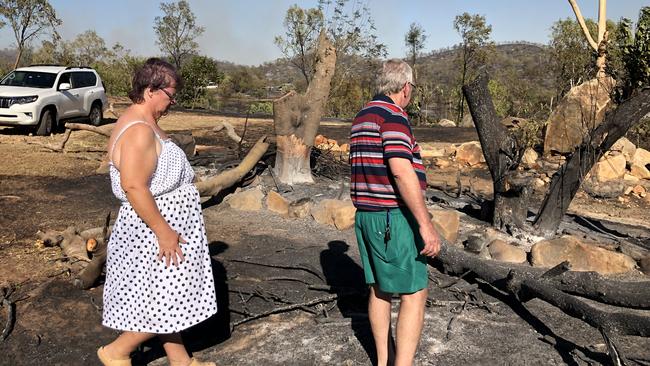 Jenny and Darryl Andersen inspect their scorched Kabra property after Wednesday’s fires. Picture: Vanessa Marsh