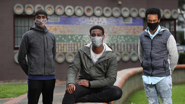 Three young community leaders are helping others express their lockdown experience at the North Melbourne Housing Commission. Ahmed Dini, Khalid Farah and Barry Berih. Picture: Alex Coppel.