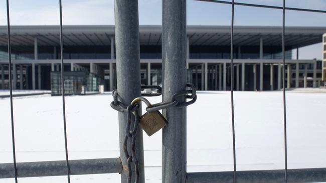 A fence bars entry to the never completed terminal of the Berlin Brandenburg International Airport. Picture: AP Photo/Markus Schreiber.