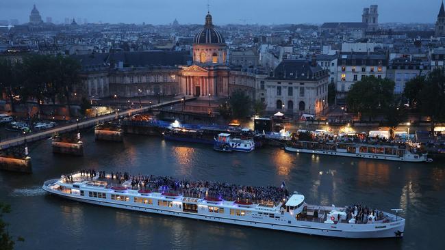 Team France cruise the Seine. Photo by Richard Heathcote / POOL / AFP.