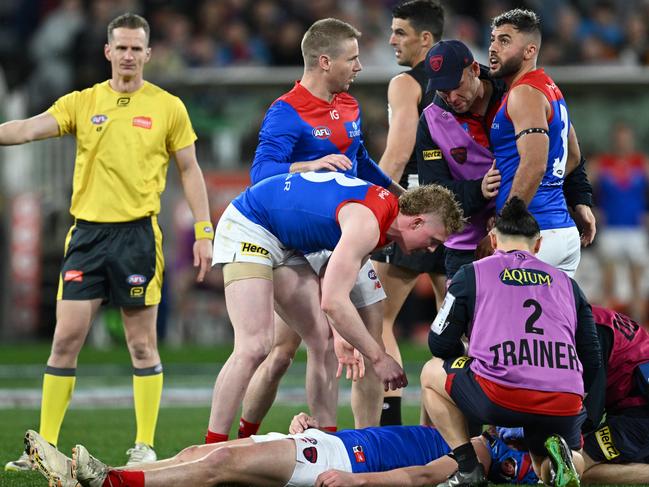 MELBOURNE, AUSTRALIA - SEPTEMBER 07: Angus Brayshaw of the Demons lays on the ground knocked out during the AFL First Qualifying Final match between Collingwood Magpies and Melbourne Demons at Melbourne Cricket Ground, on September 07, 2023, in Melbourne, Australia. (Photo by Quinn Rooney/Getty Images)