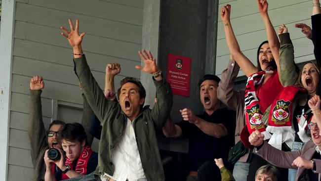 Wrexham co-owners Ryan Reynolds (left) and Rob McElhenney celebrate after Wrexham scored their second goal. Photo by Martin Rickett/PA Images via Getty Images.