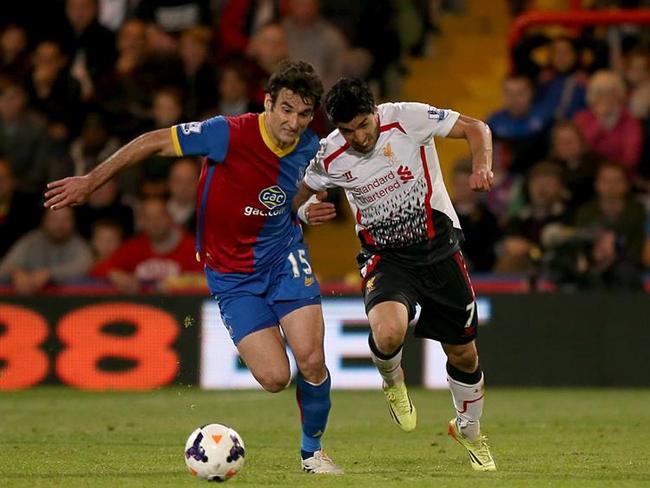 Jedinak dances the tango with Liverpool’s Luis Suarez.