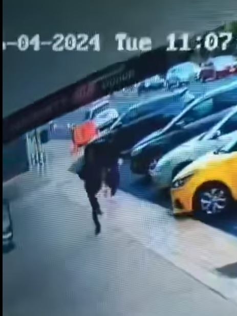 The worker then sprints after the offender before tackling him in the car park.