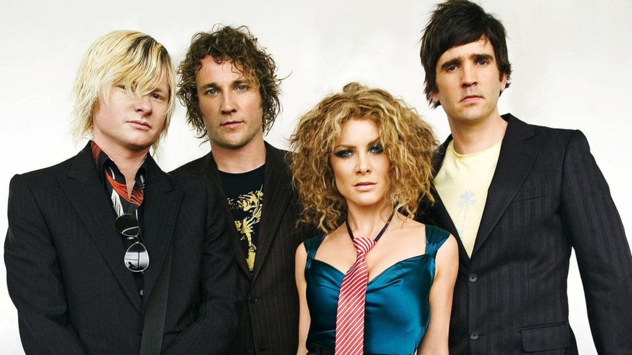 Natalie Bassingthwaighte with Cameron McGlinchey (second from left) and their Rogue Traders bandmates.