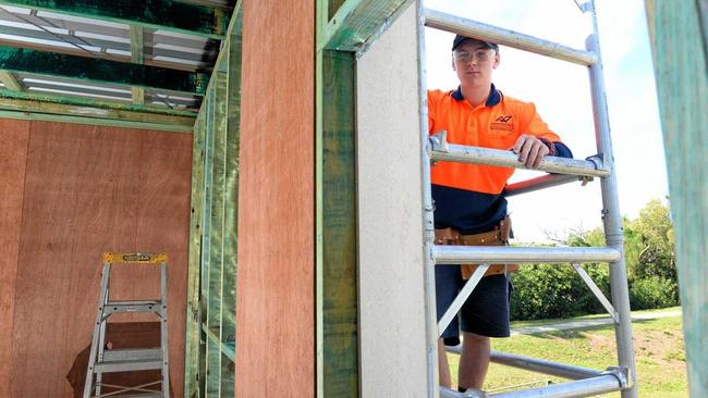 Callum Mahoney gets to work on the 'Building Futures Program' house at North Ipswich. Picture: Rob Williams