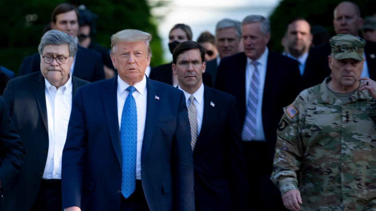 General Milley walked alongside US Attorney General William Barr (L) and US Secretary of Defence Mark Esper (C). Picture: Brendan Smialowski/AFP