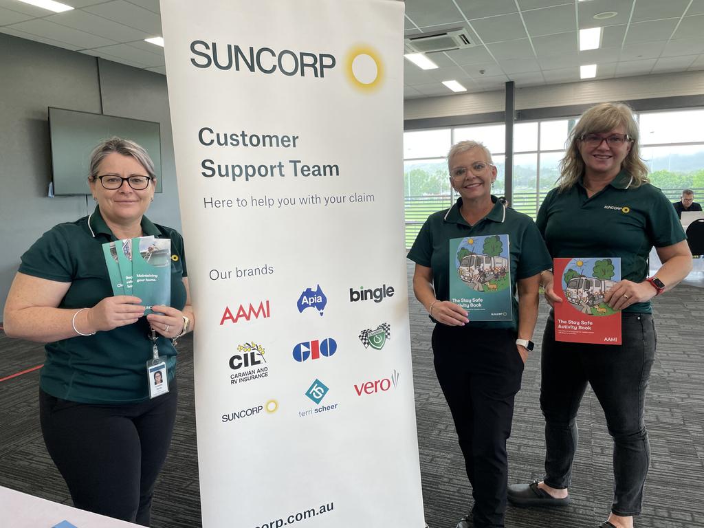 Suncorp staff members Vicki Kerby, Romany Jones, and Kim Borkowski are ready offer assistance at the Insurance Hub, established at the Townsville Sports Stadium in Annandale. Photo: Leighton Smith.