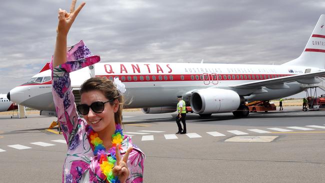 ALICE Springs dental nurse Aimee Smith was feeling the Ô60s vibe at the airport on Saturday, when a Qantas Retro Roo II flew into Alice Springs.