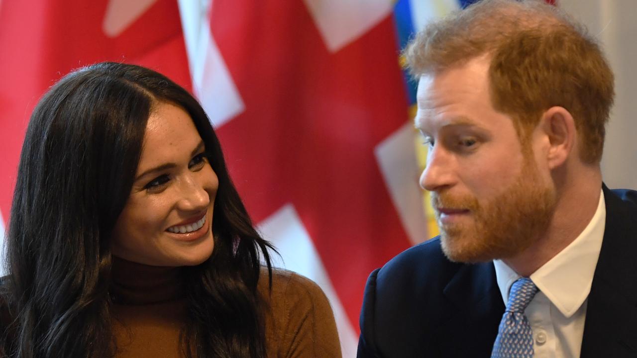 LONDON, UNITED KINGDOM - JANUARY 07: Prince Harry, Duke of Sussex and Meghan, Duchess of Sussex gesture during their visit to Canada House in thanks for the warm Canadian hospitality and support they received during their recent stay in Canada, on January 7, 2020 in London, England. (Photo by DANIEL LEAL-OLIVAS  - WPA Pool/Getty Images)