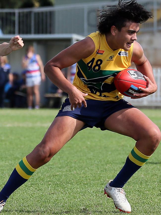 Eagle Rome Burgoyne bursts clear from a pack. Picture: SANFL