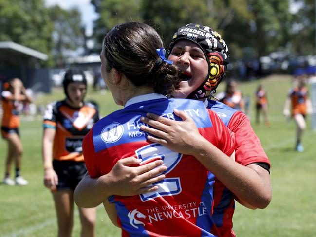 Lily Porter (headgear) celebrates with Makenzi Nelson after her second try. Picture: Michael Gorton