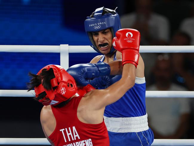 PARIS, FRANCE - AUGUST 06: Imane Khelif of Team Algeria punches Janjaem Suwannapheng of Team Thailand during the Women's 66kg Semifinal round match on day eleven of the Olympic Games Paris 2024 at Roland Garros on August 06, 2024 in Paris, France. (Photo by Matthew Stockman/Getty Images) *** BESTPIX ***