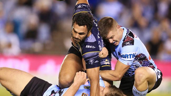 the Cowboys' Justin O'Neill tackled   during the Cronulla Sharks v North Queensland Cowboys NRL round 11  game at Southern Cross Group Stadium, Cronulla. pic Mark Evans