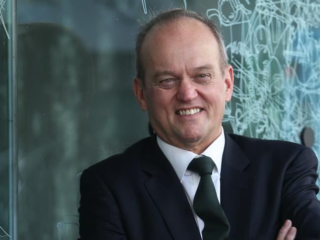 07/02/2019. Adrian Collette, newly appointed chief executive of the Australia Council for the Arts. Photographed at their offices in Surry Hills, Sydney. Artwork in background on window by Gosia Wlodarczak, Frost and shadow drawing for the Australia Council.  Britta Campion / The Australian