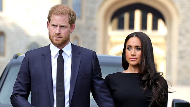 WINDSOR, ENGLAND - SEPTEMBER 10: Prince Harry, Duke of Sussex, and Meghan, Duchess of Sussex on the long Walk at Windsor Castle arrive to view flowers and tributes to HM Queen Elizabeth on September 10, 2022 in Windsor, England. Crowds have gathered and tributes left at the gates of Windsor Castle to Queen Elizabeth II, who died at Balmoral Castle on 8 September, 2022. (Photo by Chris Jackson/Getty Images)