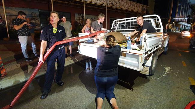 Firefighters and wildlife rescuers try their best to keep a turtle, which was struck by a boat propeller, alive.