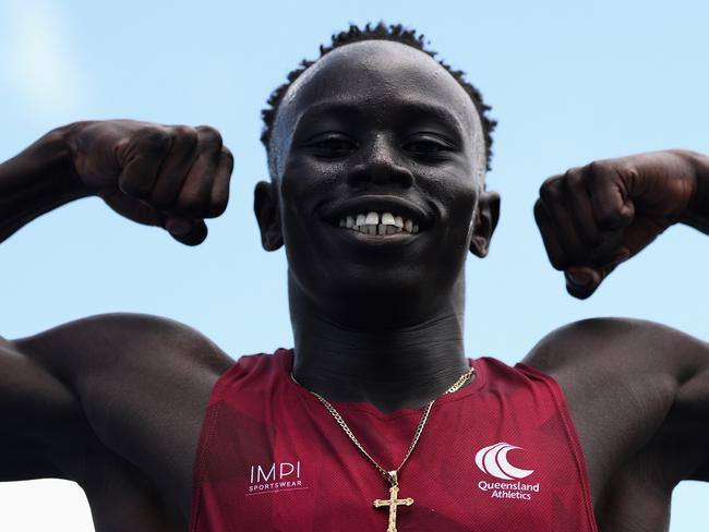 BRISBANE, AUSTRALIA - DECEMBER 06: Gout Gout of Queensland poses after winning his Boys' U18 100m heat in 10.04 seconds with a +3.4 tail-wind during the 2024 Chemist Warehouse Australian All Schools Athletics Championship at Queensland Sport and Athletics Centre on December 06, 2024 in Brisbane, Australia. (Photo by Cameron Spencer/Getty Images)