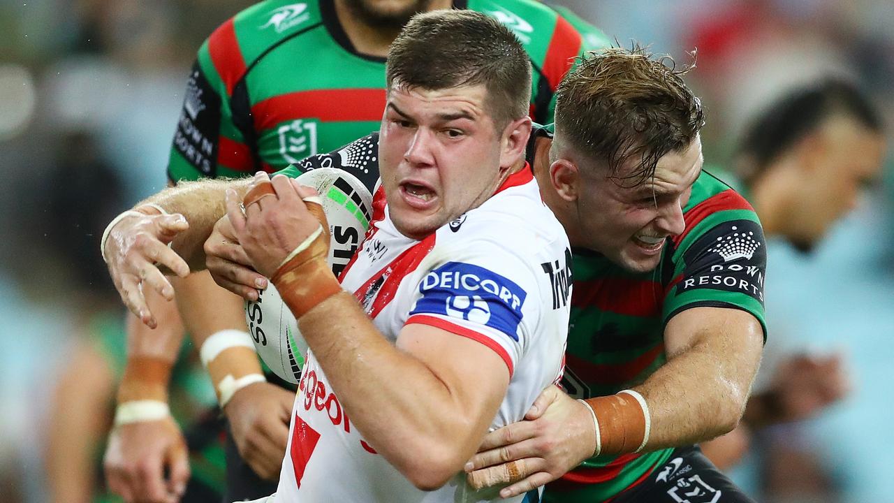 Blake Lawrie is wrapped up by Souths skipper Cameron Murray. Picture: Mark Metcalfe/Getty Images